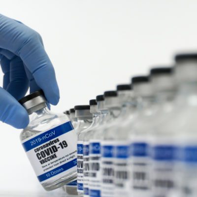Vaccine vials with "coronavirus COVID-19 Vaccine" text on label