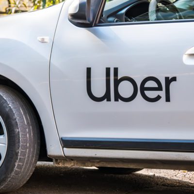 Uber logo on white car