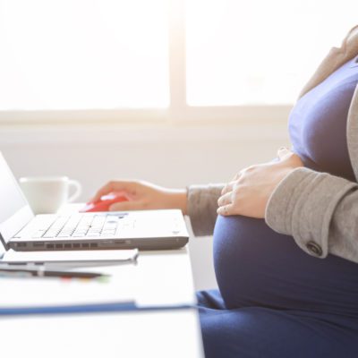 Pregnant lady working at laptop
